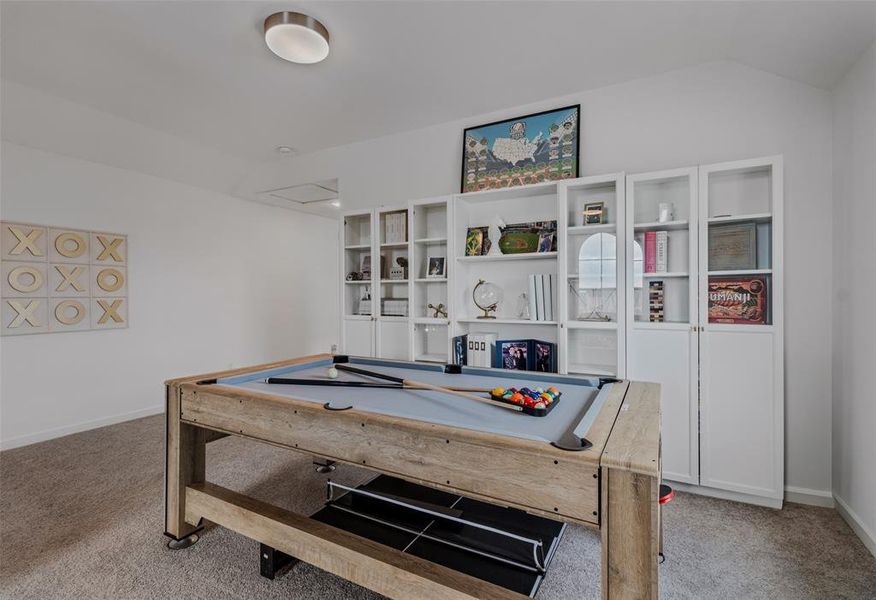 Playroom with lofted ceiling, light colored carpet, and billiards