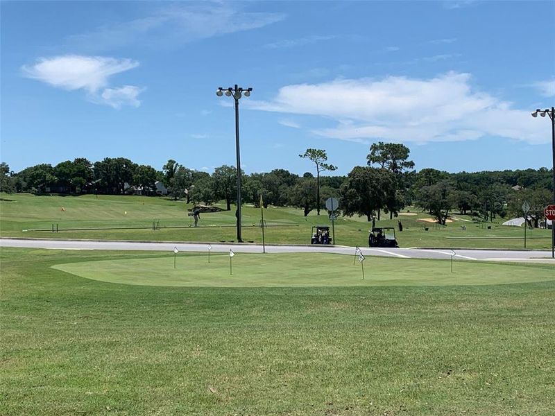 putting green at entrance to community