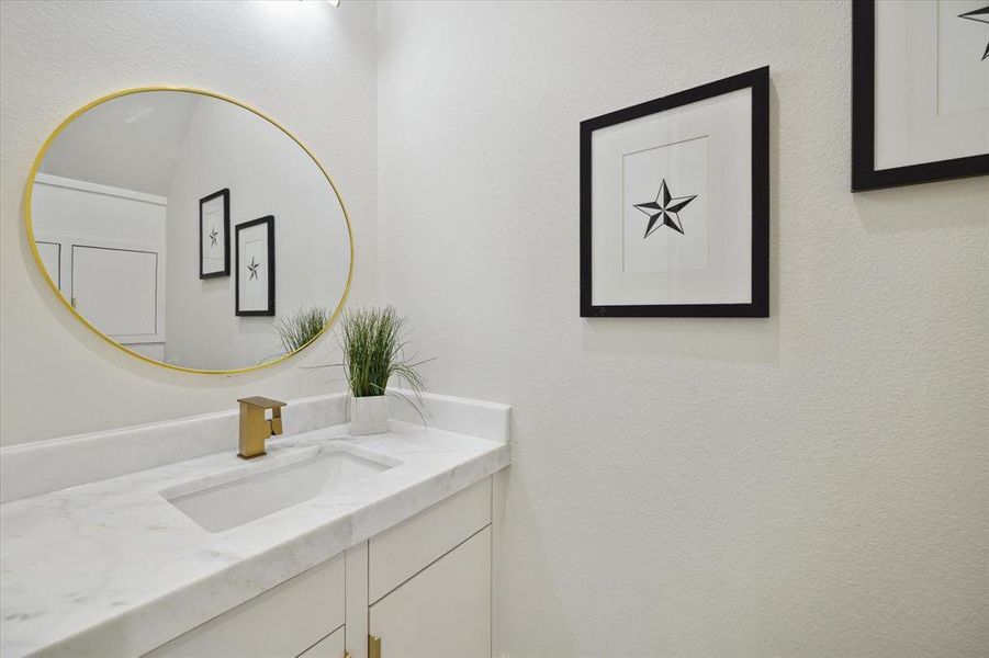 Chic half bath with modern fixtures and tasteful décor.