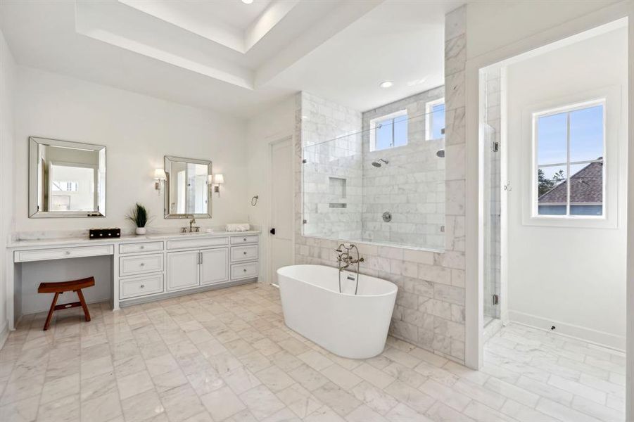 Dual sided sinks + vanity area and tray ceiling.