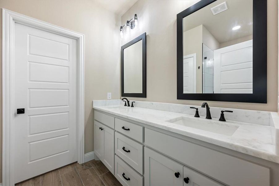 Bathroom with dual vanities