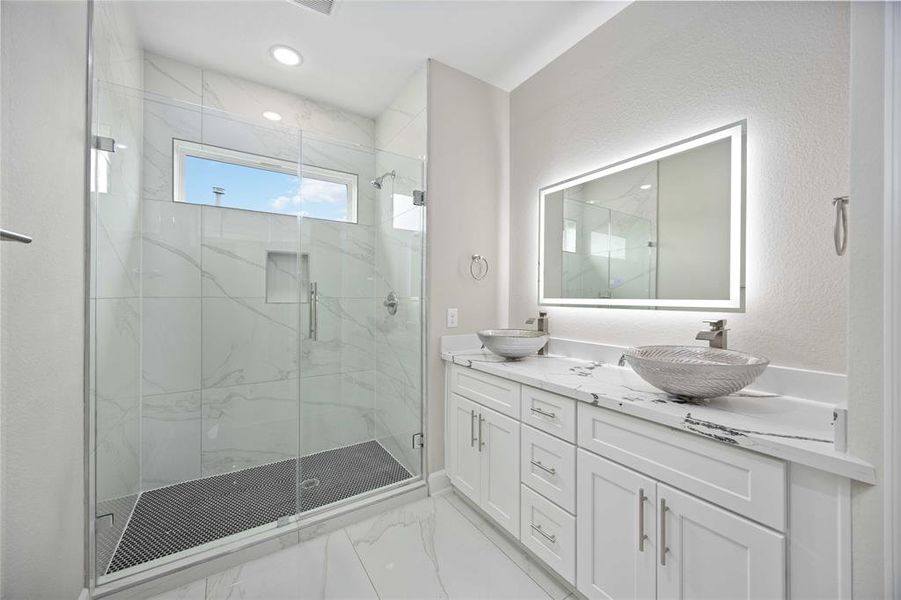 Owner's suite bathroom with double vanities