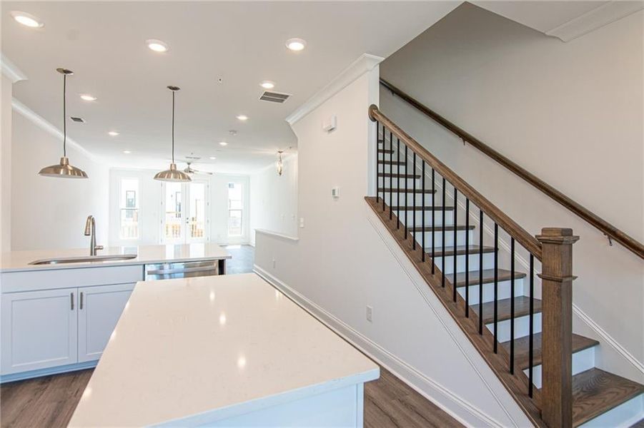 Kitchen with stairs going up to the 3 rd Level where the the bedrooms are. not the actual unit previously built