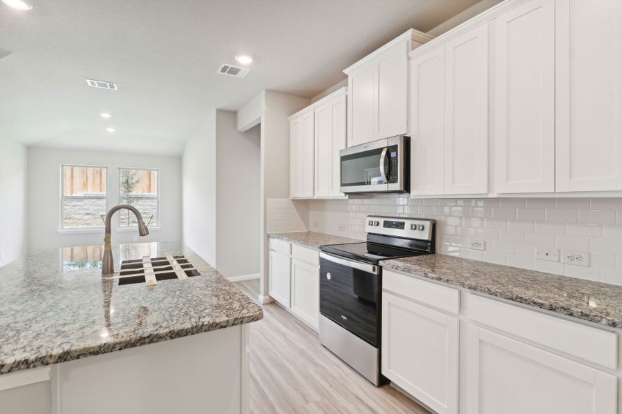 Kitchen in the Callaghan floorplan at a Meritage Homes community.