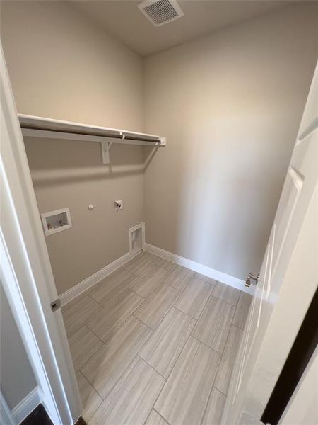 Washroom featuring electric dryer hookup, gas dryer hookup, and hookup for a washing machine