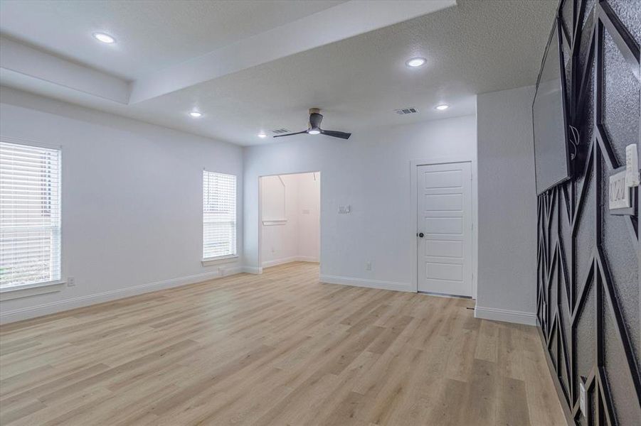 Unfurnished room featuring ceiling fan and light hardwood / wood-style floors