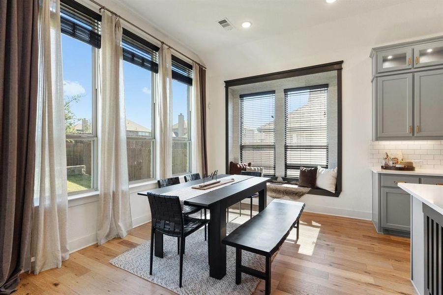 Dining space featuring a wealth of natural light and light hardwood / wood-style flooring