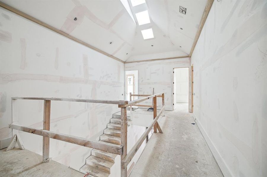 Another view of the Open Second Floor Landing/Hallway and a Light filled Staircase from the Skylights above.