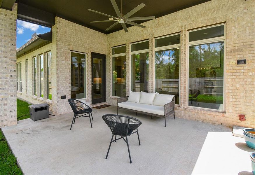 Extended rear patio with ceiling fan.
