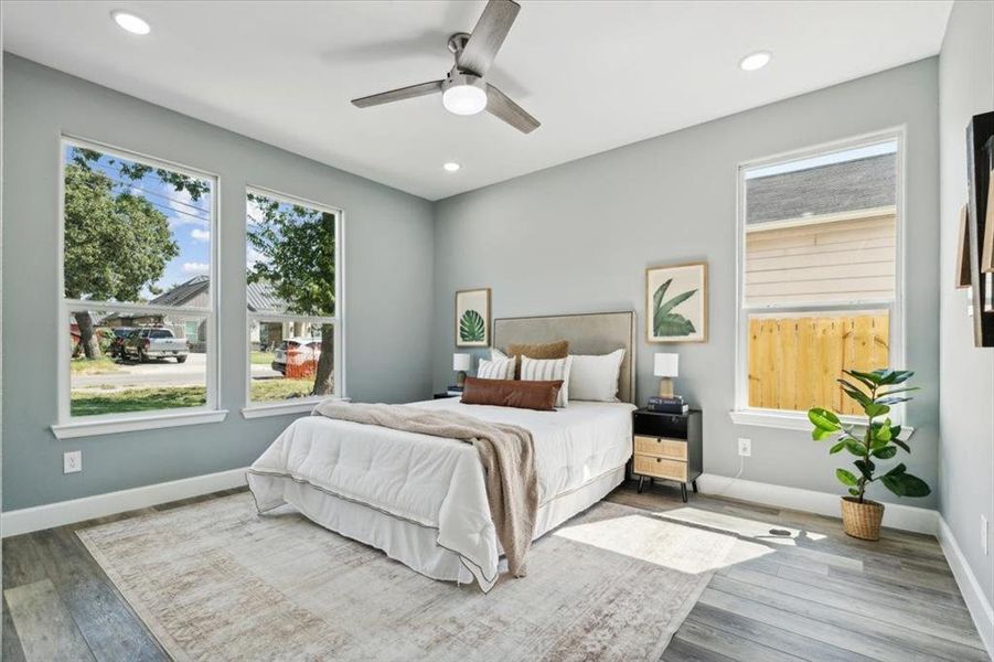 Bedroom with wood-type flooring and ceiling fan