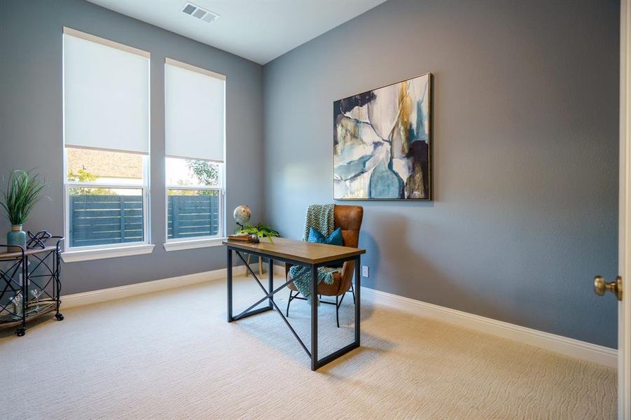 View of carpeted home office