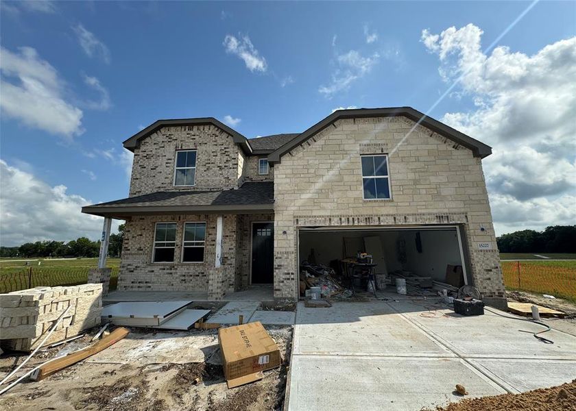 Two-story home with 4 bedrooms, 3.5 baths and 2 car garage on a lake lot
