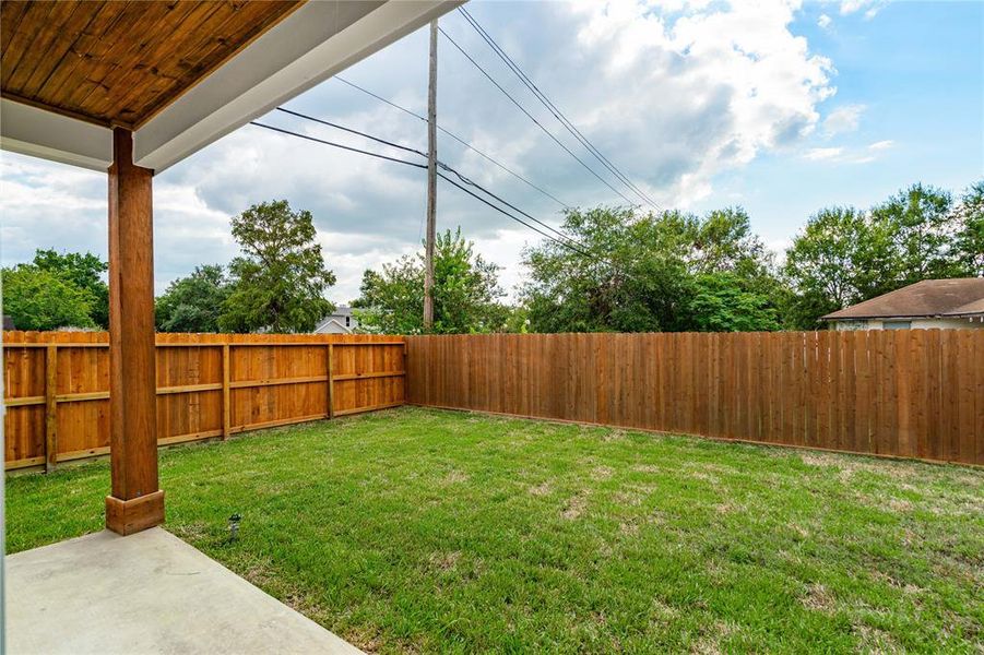 Roomy back yard and covered patio