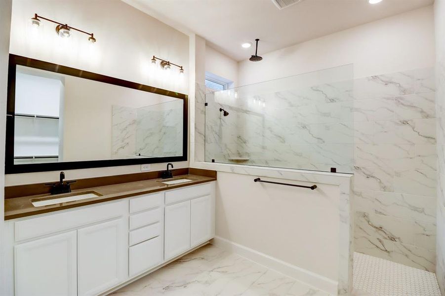 EXAMPLE PHOTO: Big walk in shower & quartz counters with dual sinks