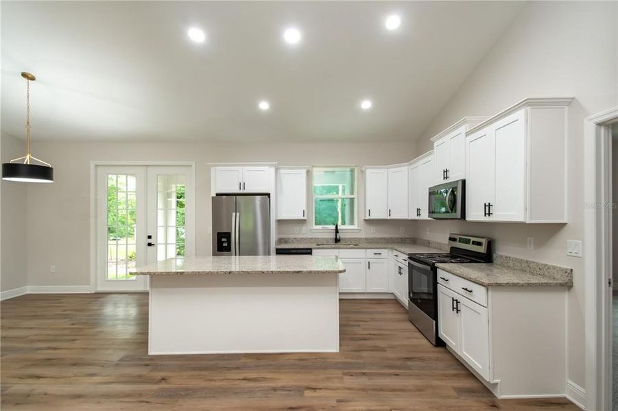 Kitchen with Customer Soft Close Cabinets, Granite Countertops with Stainless Steel Appliances