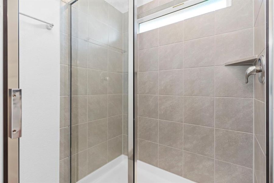 Huge Shower with beautiful Tile Surroundings! Never run out of hot water with the Tankless/On-Demand H2O Heater!!! **Image Representative of Plan Only and May Vary as Built**