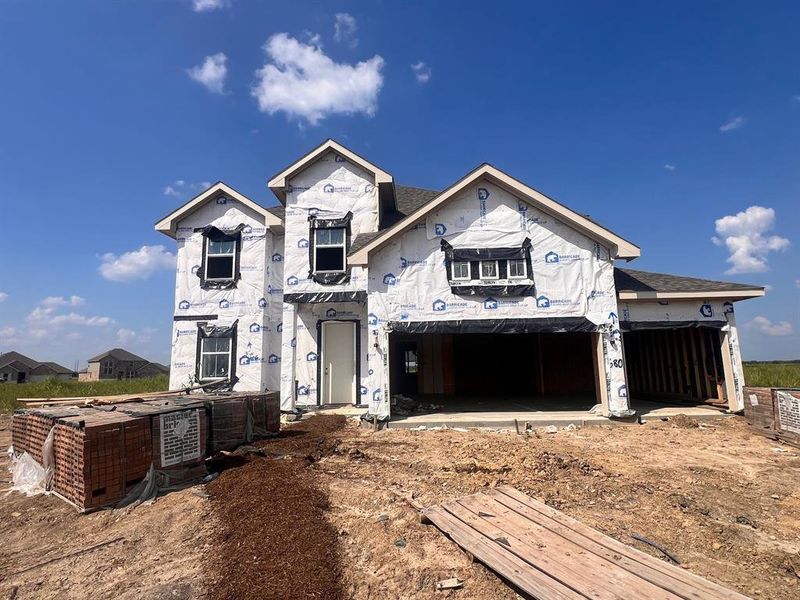 Two-story home with 4 bedrooms, 3.5 baths and 3 car attached garage