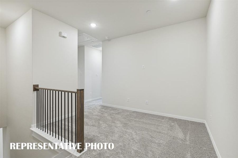 Upstairs features a loft area perfect for a home office or a place to curl up with a good book.  REPRESENTATIVE PHOTO