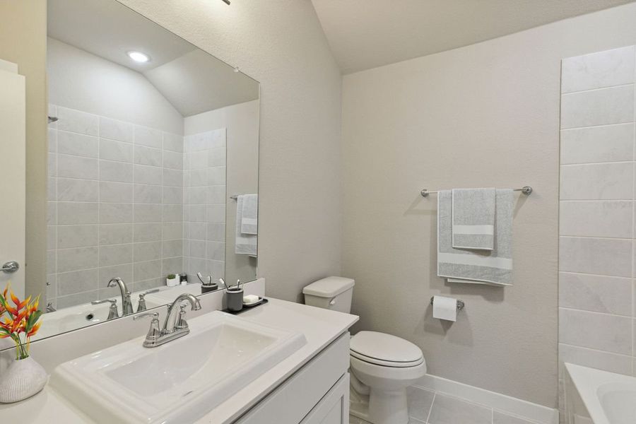Bathroom in the Claret home plan by Trophy Signature Homes – REPRESENTATIVE PHOTO