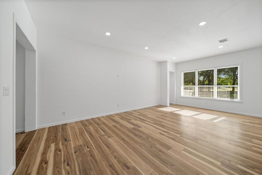 Unfurnished room featuring light wood-type flooring