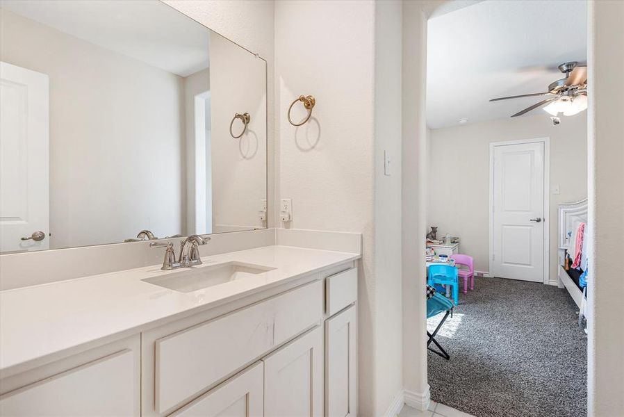 Bathroom with vanity and ceiling fan