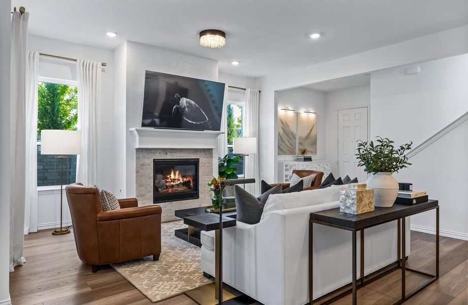 Living room featuring hardwood / wood-style flooring and a healthy amount of sunlight