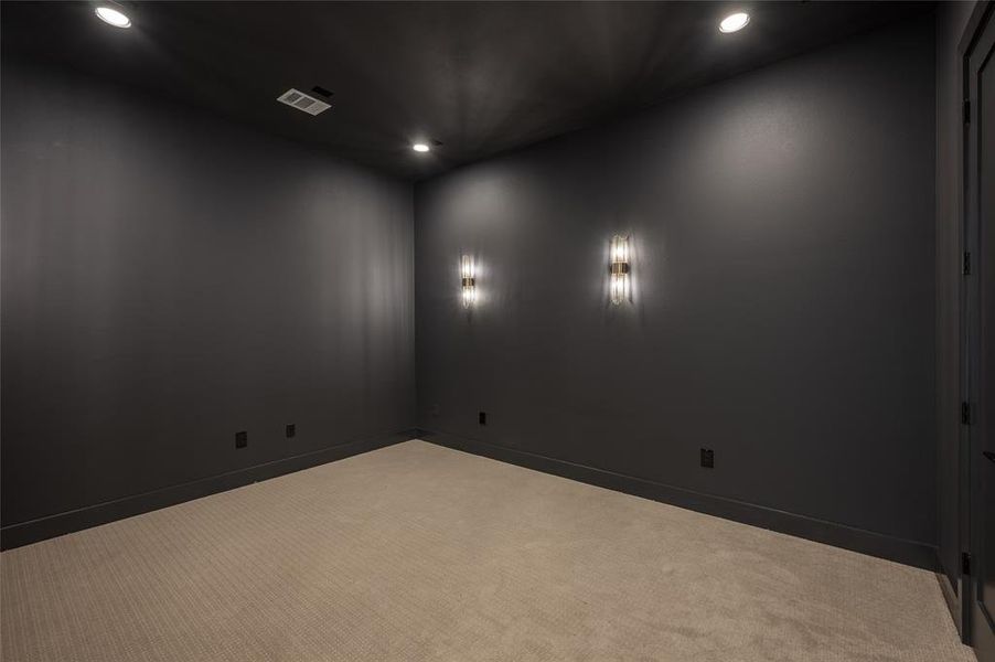 Off the game room, enjoy memorable movie nights in the media loungedecorated with handsome sconces.
