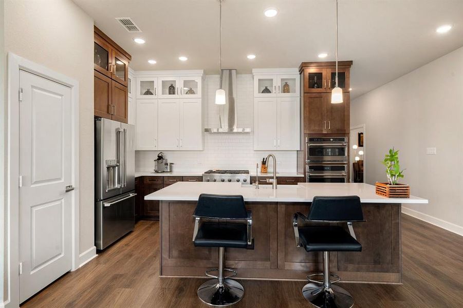 Any chef's dream, this stunning kitchen is perfect for everyday life as well as entertaining family and friends! Extra large kitchen island is perfect for conversation or that much needed space to lay out your party spread for everyone to enjoy! Large windows provide lovely views of your backyard and plenty of natural lighting throughout the day.