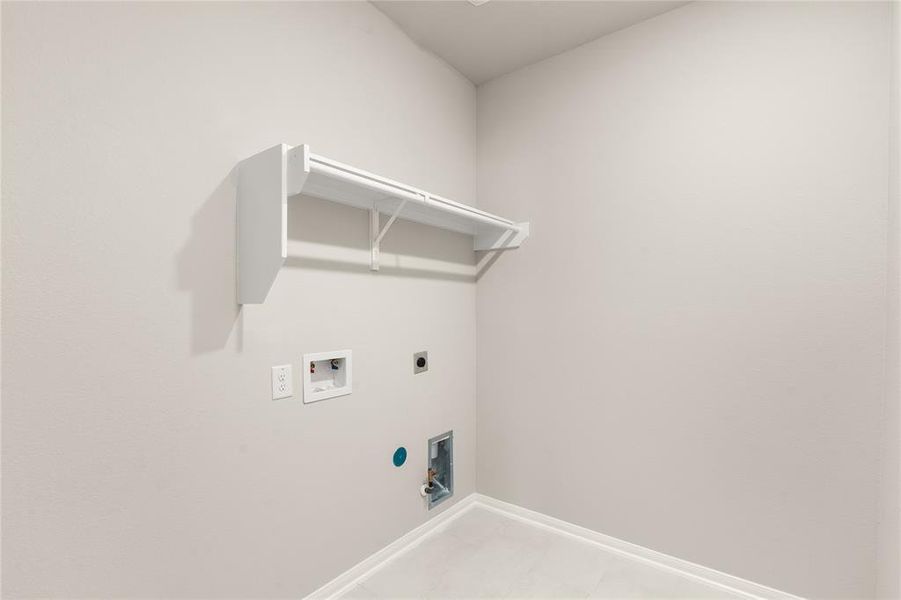 The laundry room layout is carefully planned for optimal workflow with designated areas for washing, drying, and storing.
