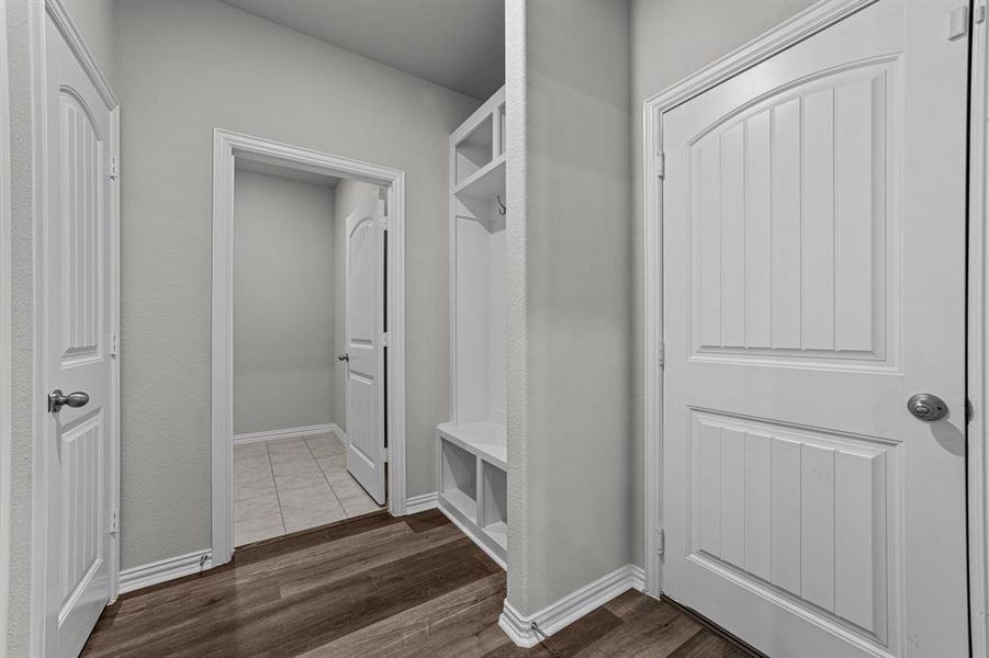 Mudroom featuring wood-type flooring