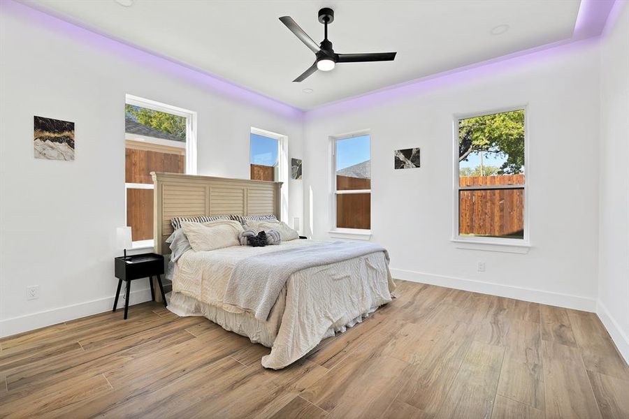 Bedroom with ceiling fan and light hardwood / wood-style flooring