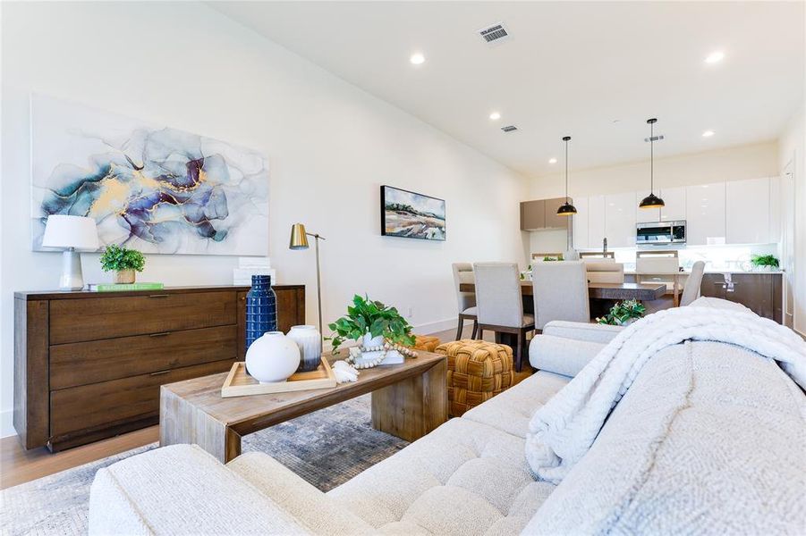 Living room with light hardwood / wood-style flooring