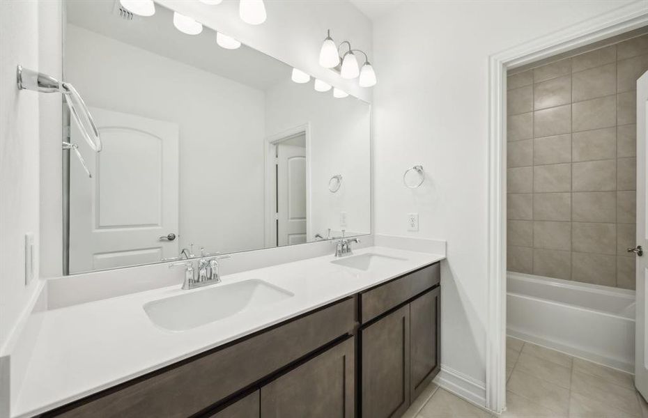 Spacious secondary bathroom with premium finishes  *real home pictured