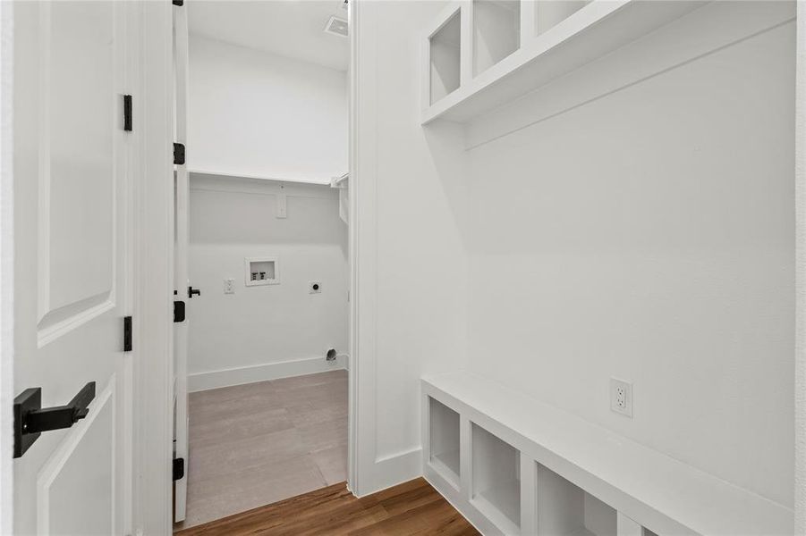 Mudroom with tile flooring