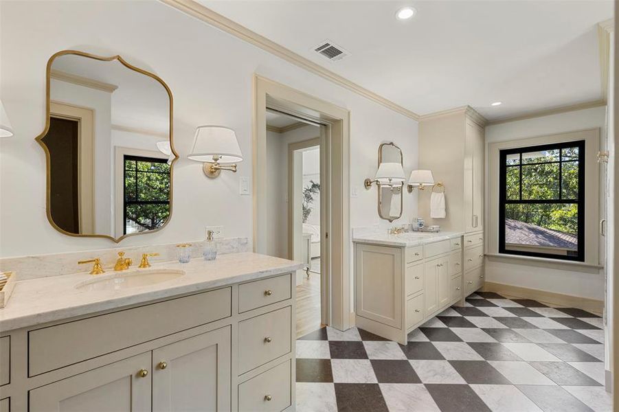 Bathroom with tile flooring, double sink vanity, and ornamental molding