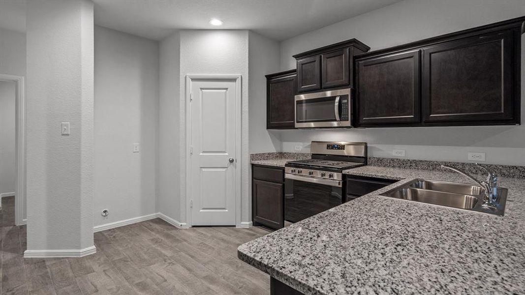 Kitchen - All Home and community information, including pricing, included features, terms, availability and amenities, are subject to change at any time without notice or obligation. All Drawings, pictures, photographs, video, square footages, floor plans, elevations, features, colors and sizes are approximate for illustration purposes only and will vary from the homes as built.