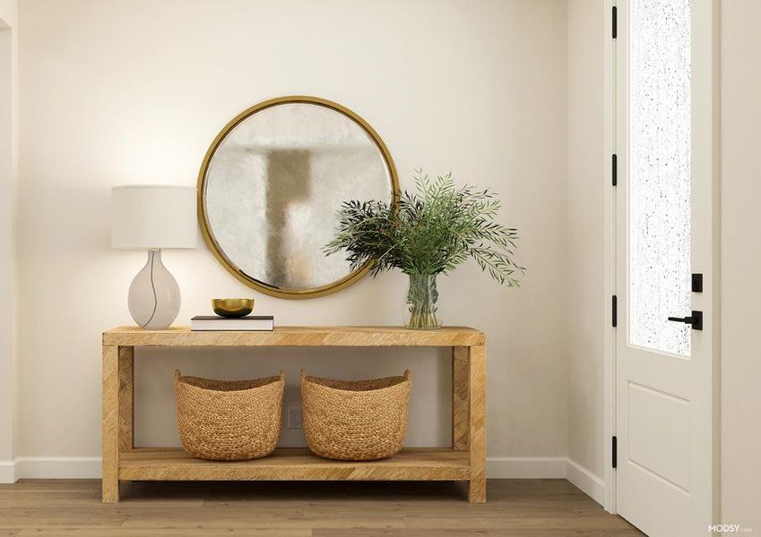 Rendering of the entryway with 3/4 lite
  door and wood-look flooring. The space is decorated with a console table,
  decorative baskets and a large, round mirror.