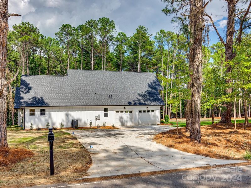 Oversize driveway, side view of the home.