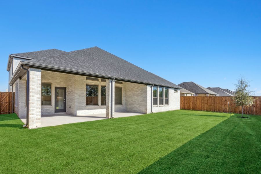 Covered Patio in the Morrison home plan by Trophy Signature Homes – REPRESENTATIVE PHOTO