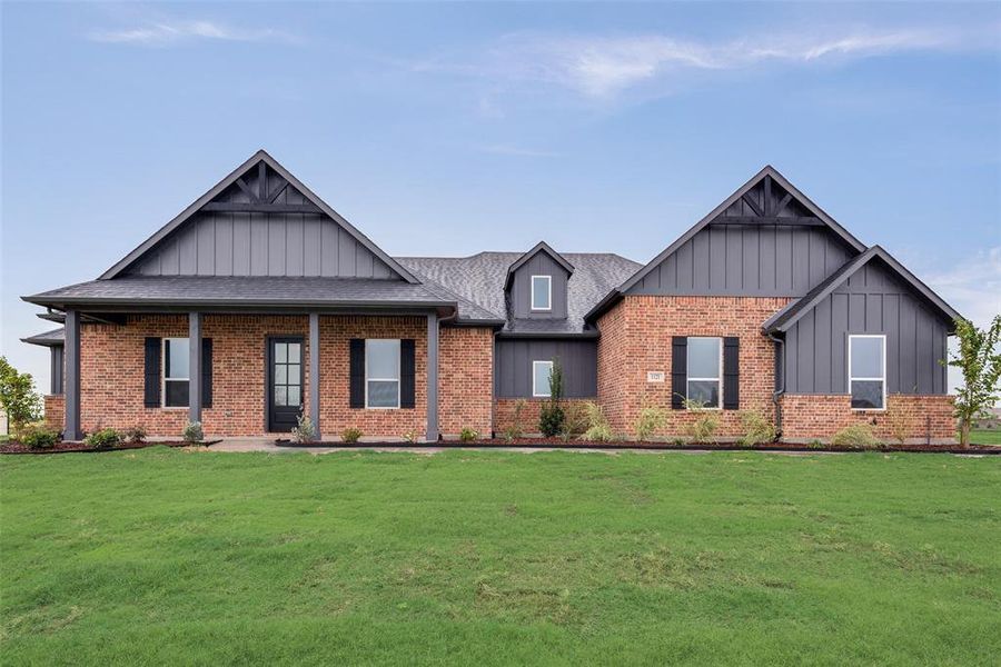 Craftsman-style house with a front lawn