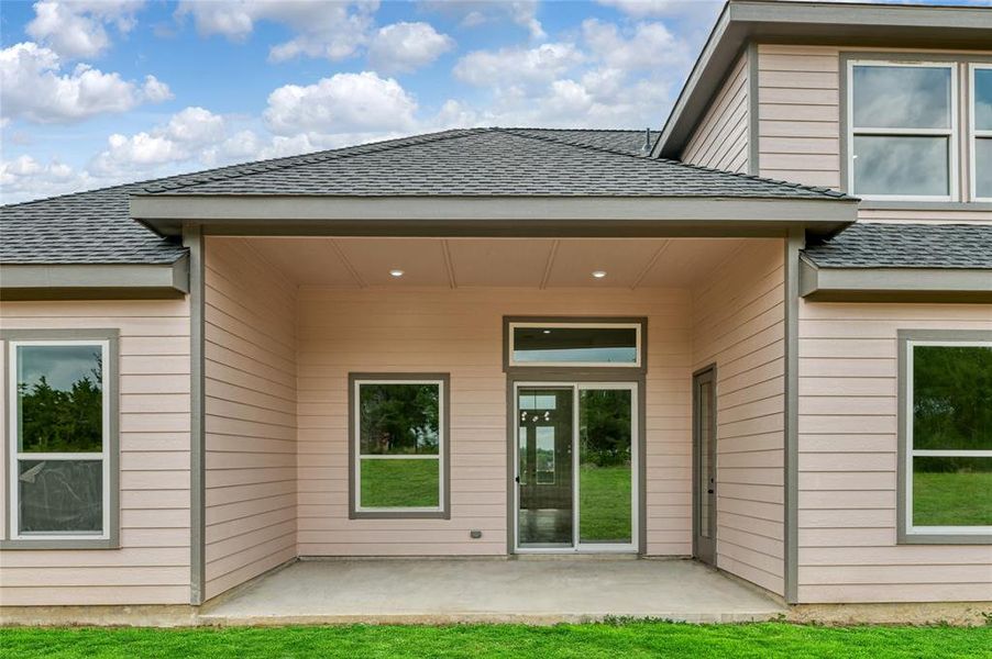 Rear view of house with a patio