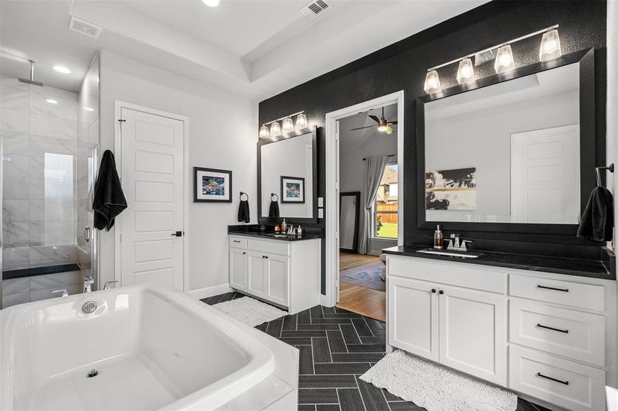 Bathroom featuring ceiling fan, tile flooring, a bath to relax in, and double sink vanity