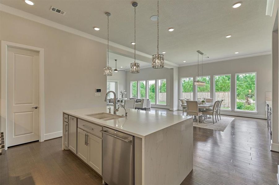 Stay in the center of the action while entertaining with fantastic views of the dining area and den. Don't forget to check out the spacious walk-in pantry for added convenience!