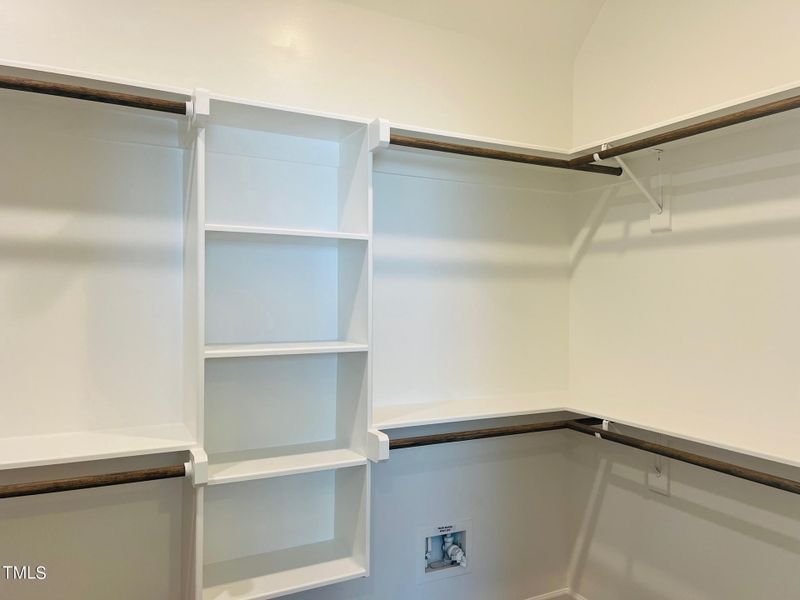 Woodshelving in Owners Closet