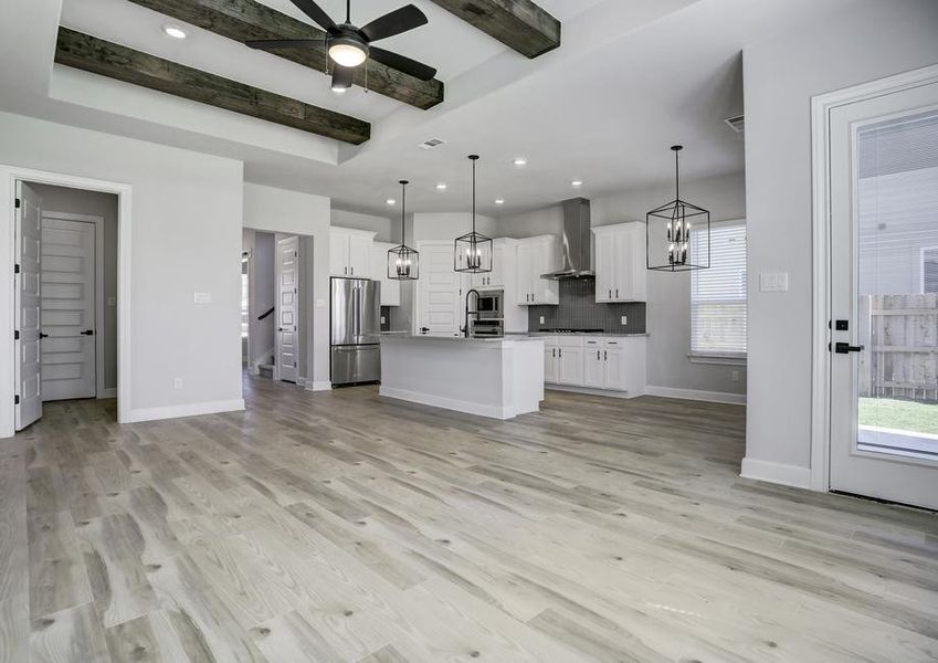 Open layout with the designer kitchen overlooking the expansive living room.