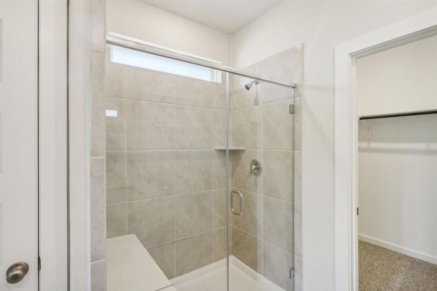 Standing shower with a sitting area