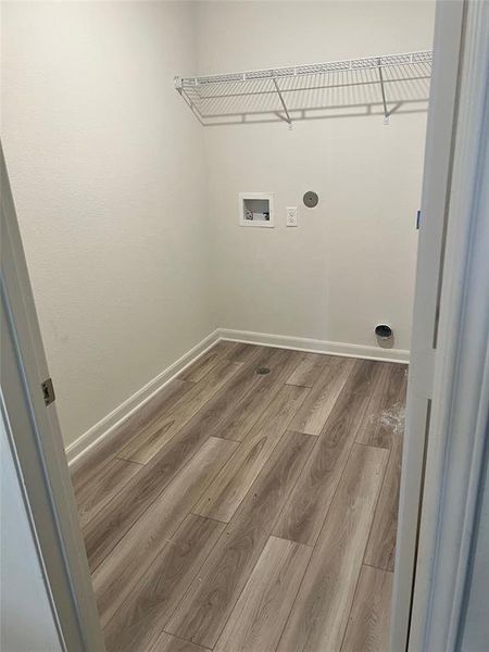 Laundry area featuring vinyl flooring and hookup for a washing machine