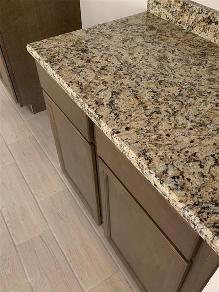 actual granite, cabinet & tile flooring