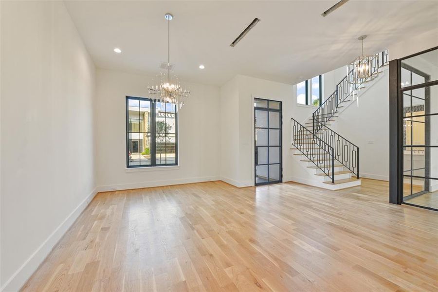 Gleaming hardwood floors, custom lighting and large window set the tone for elegant dining or gathering with family and friends for any occasion.