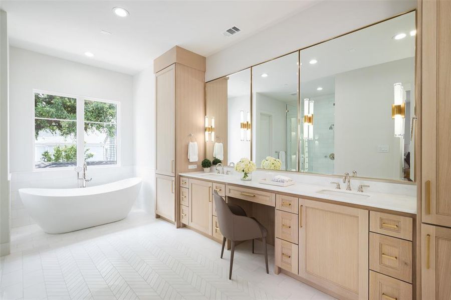 Bathroom featuring vanity with extensive cabinet space, double sink, a bath, and tile floors
